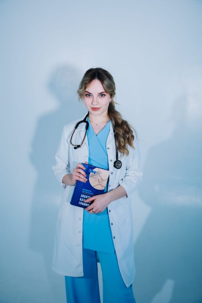 A healthcare professional wearing scrubs and a stethoscope